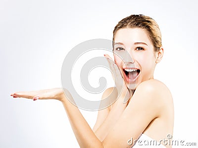 Woman showing beauty product on her handÂ  Stock Photo